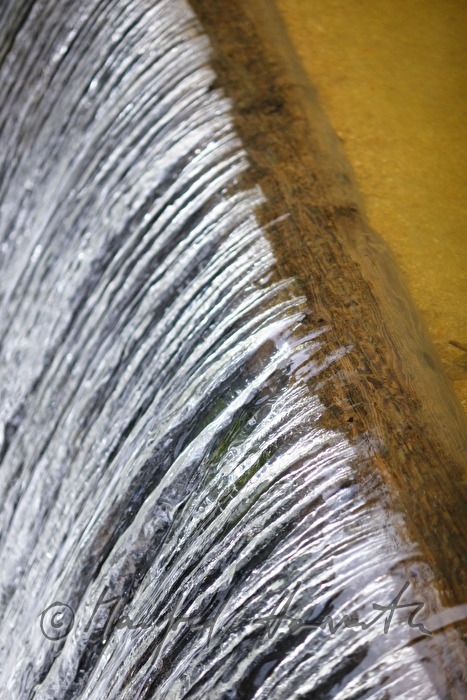 waterfall and dam near an old water mill