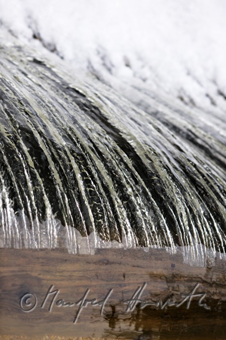waterfall and dam near an old water mill