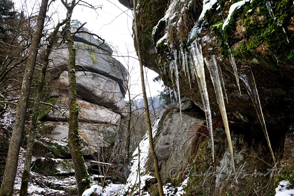 moss-covered rock and fissured granite