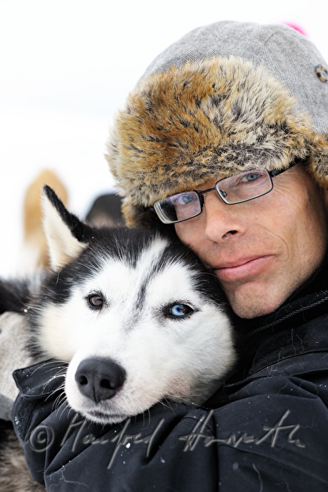 musher with dog sled husky