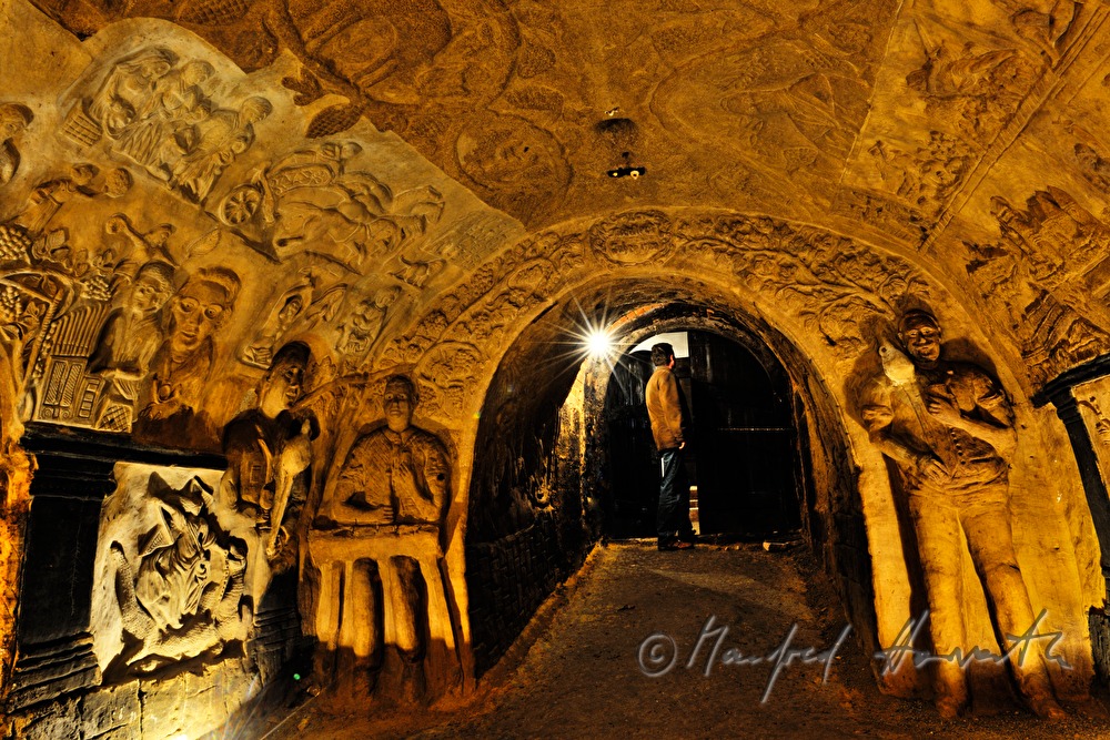 wine cellar with carvings in the clay wall and ceiling