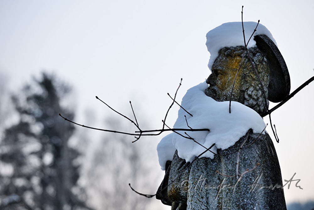 snowcovered statue of Holy Nepumuk