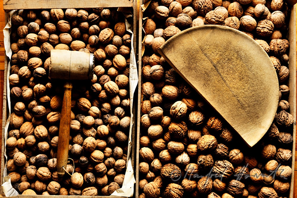cracking open nuts with a hammer