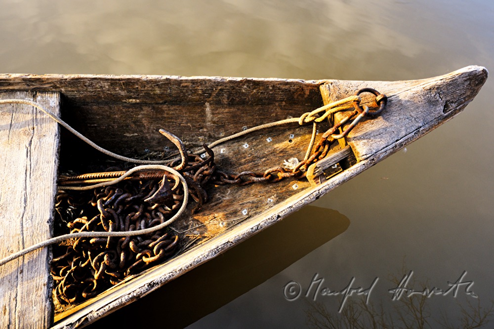 bow of a dumb barge with chain and anchor