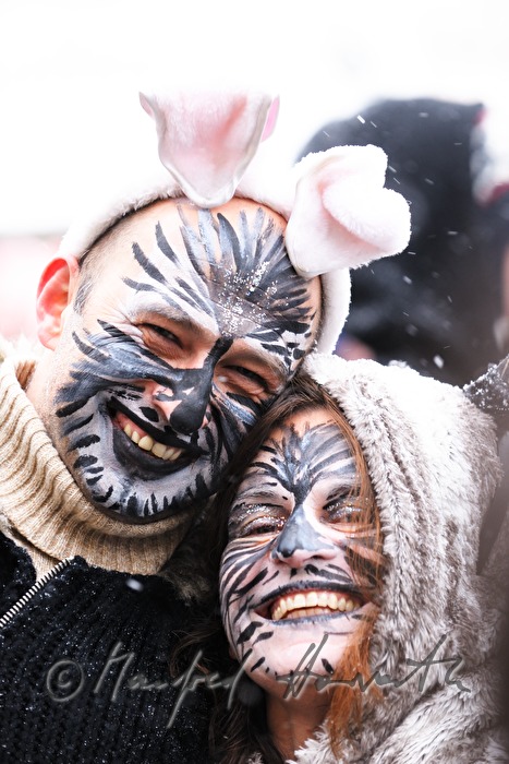 couple disguised as cats on Mardi Gras