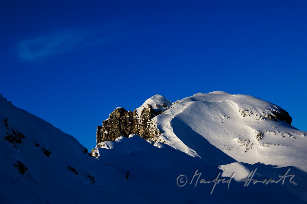 tracks of the ski tourers over the tree line
