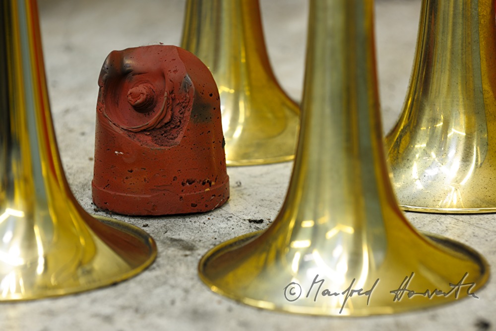 polishing stone and bells of trumpets