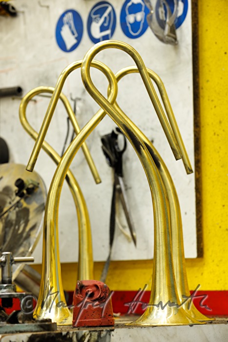 polishing stone and bells of trumpets