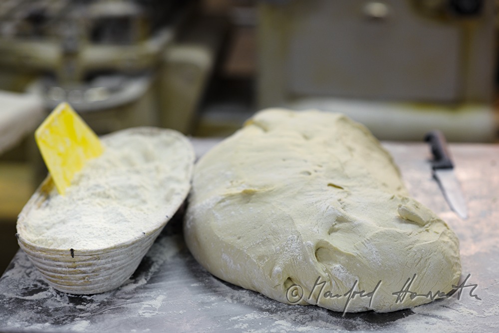 workplace with knive, wheat flour and wheat dough