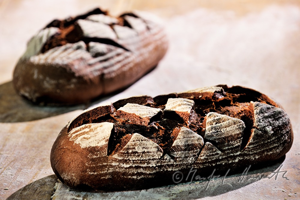 freshly baked rye bread near the baking oven