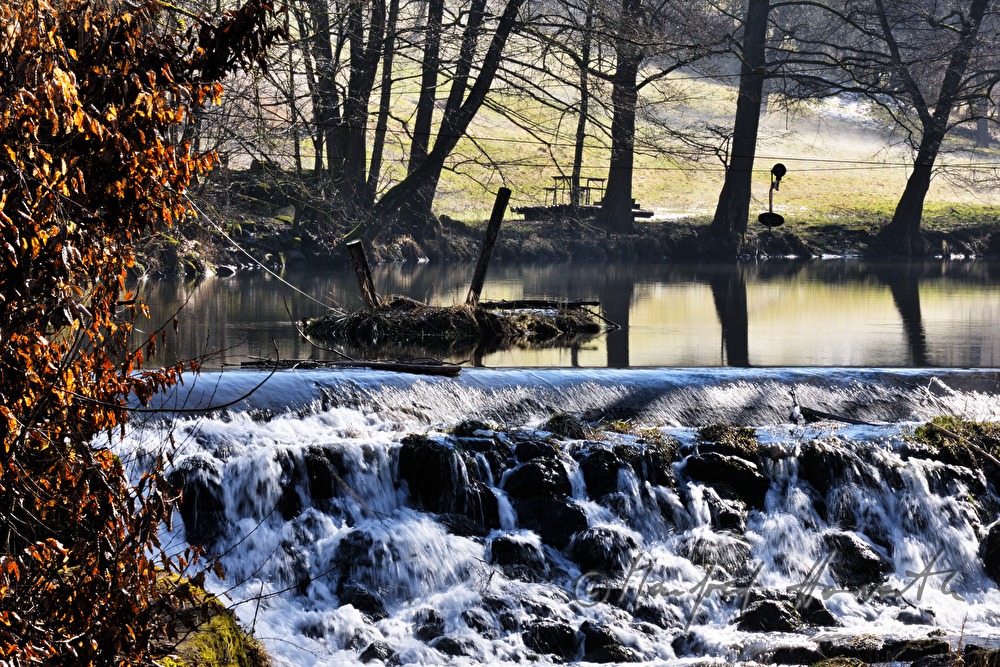 waterfall and pond near the dam