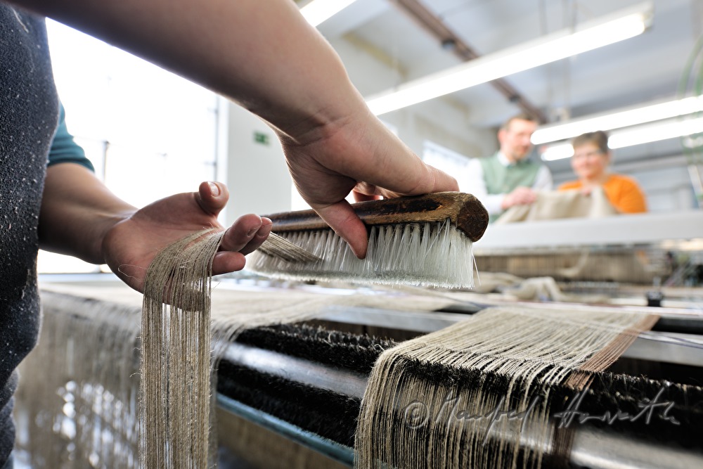 weaving of linen cloth on the mechanic loom