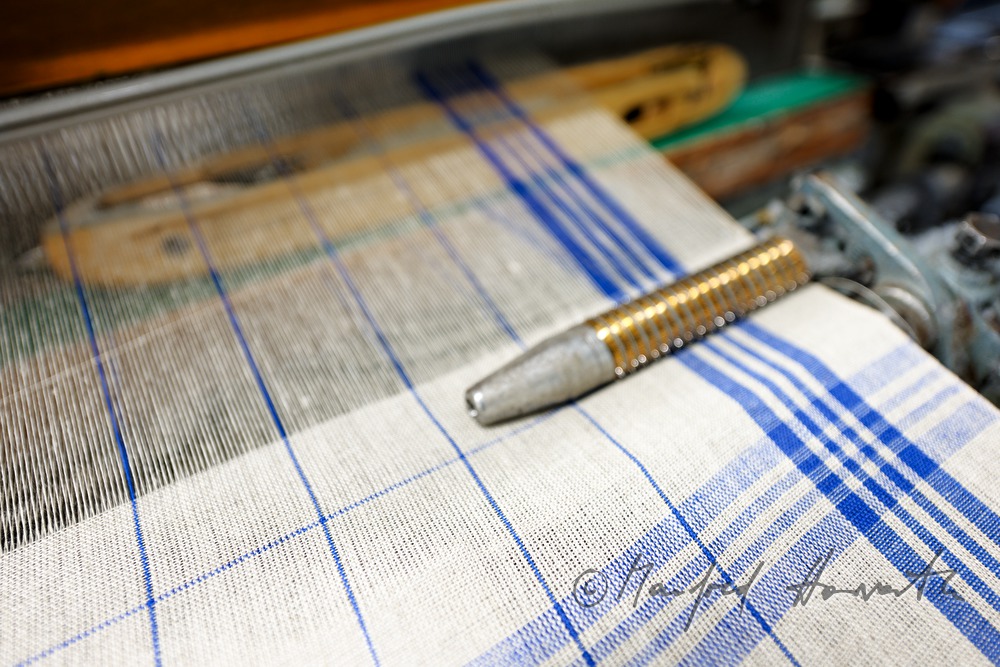 weaving of linen cloth on the mechanic loom