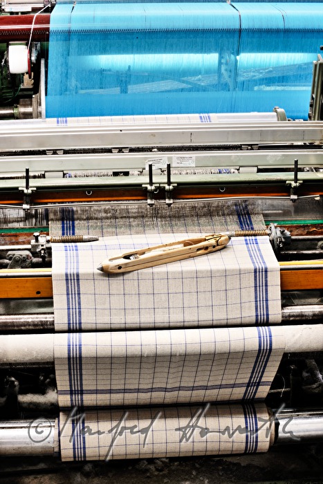weaving of linen cloth on the mechanic loom