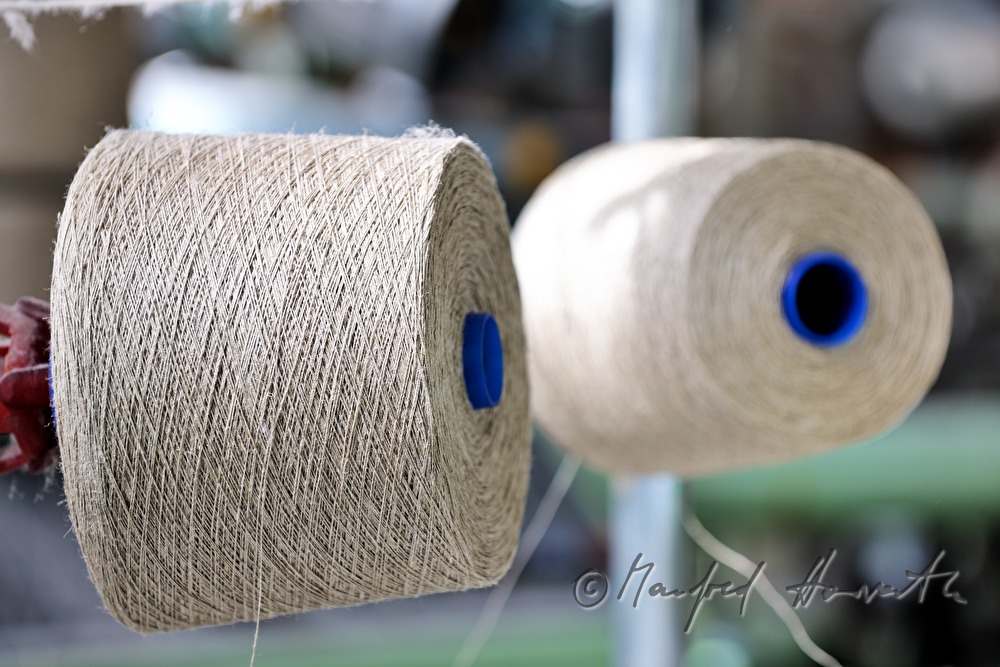 weaving of linen cloth on the mechanic loom