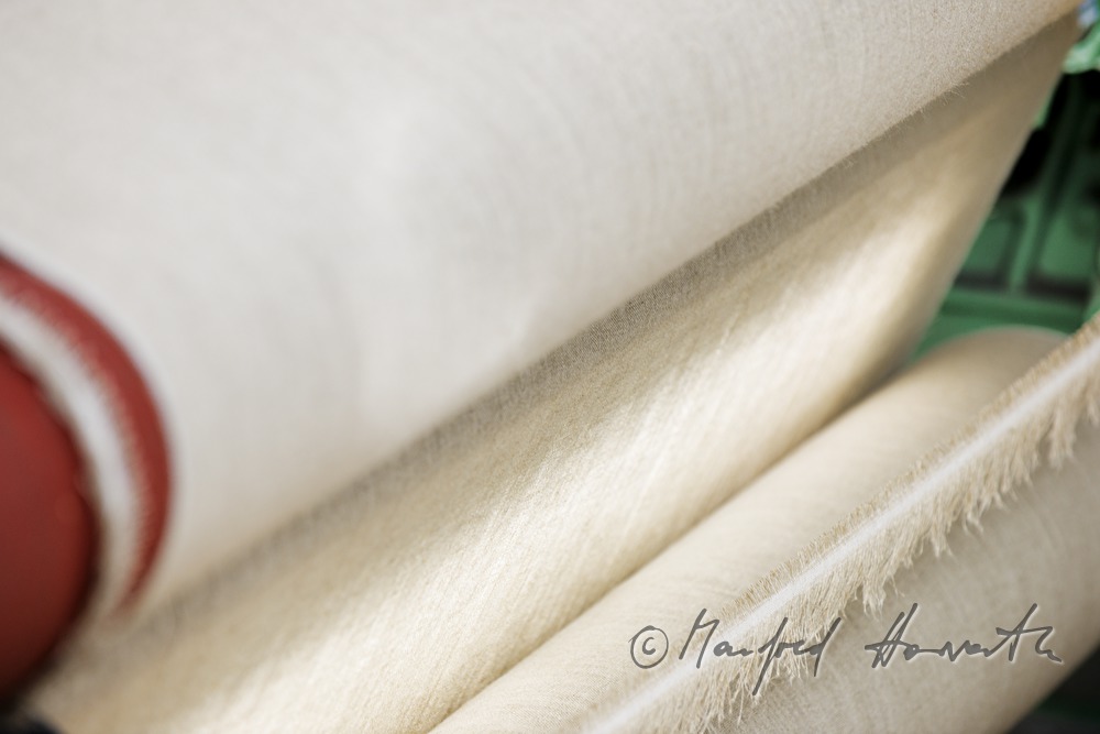 weaving of linen cloth on the mechanic loom