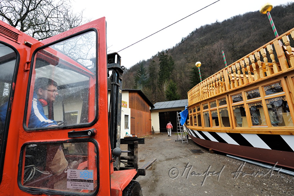 wooden ferryboat in front of the workshop of barge builder Witti