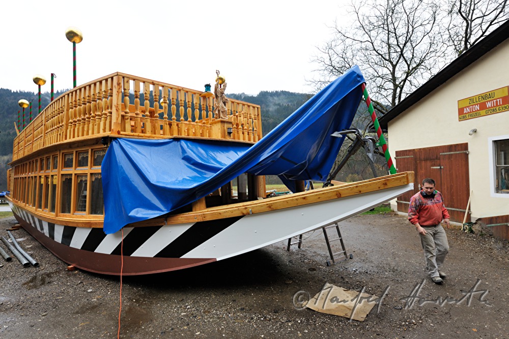 wooden ferryboat in front of the workshop of barge builder Witti