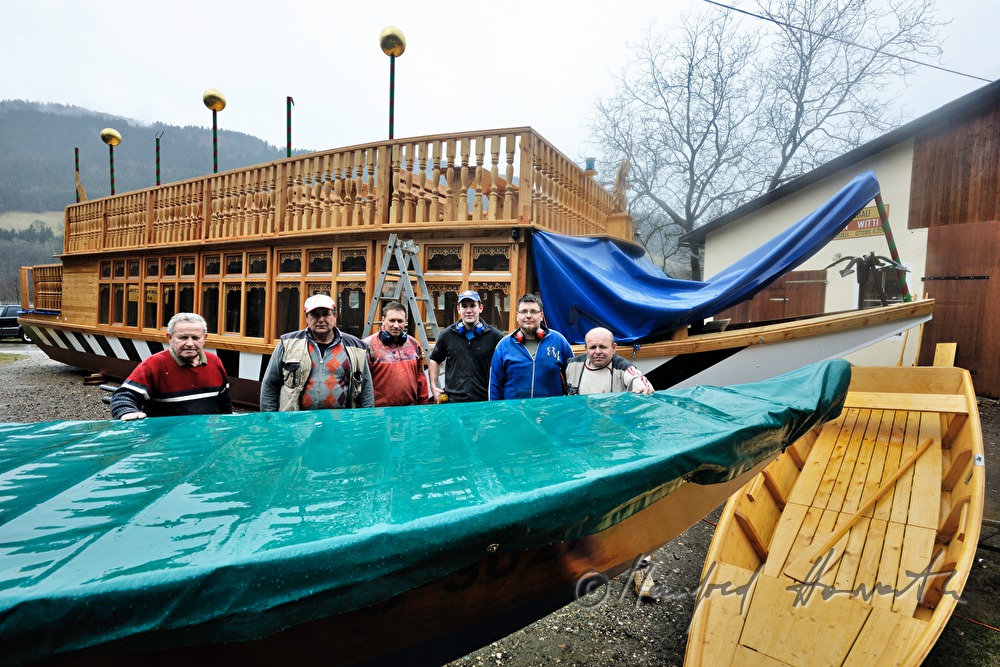 wooden ferryboat in front of the workshop of barge builder Witti