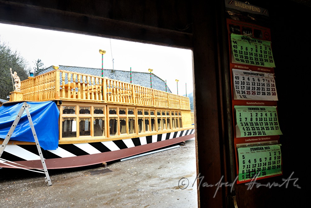 new built barge is being carried into the workshop