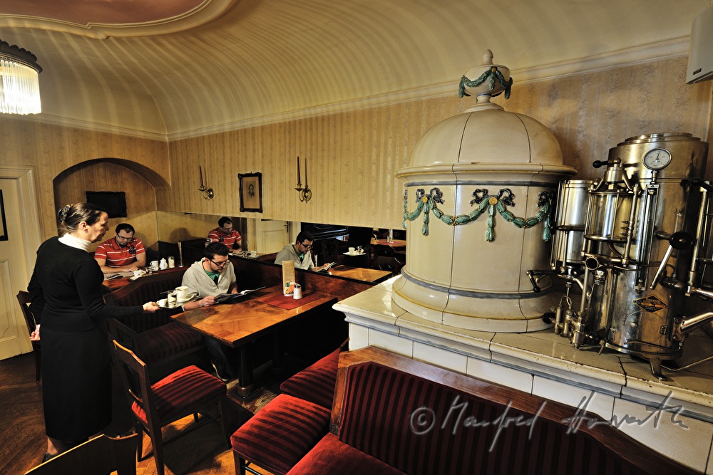 waitress serves coffee in the Cafe Blumensträussl