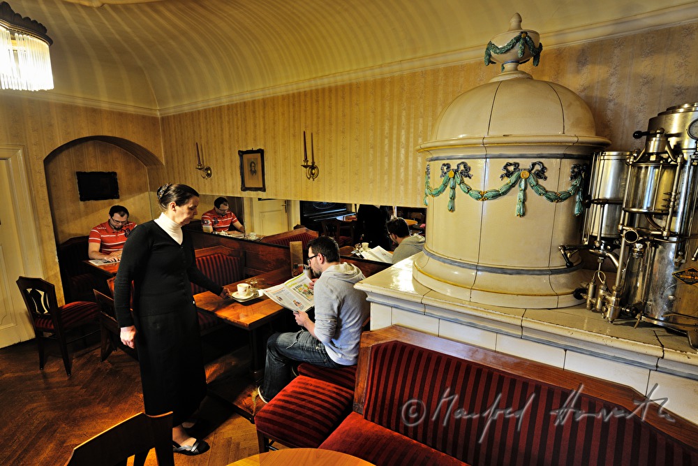 waitress serves coffee in the Cafe Blumensträussl