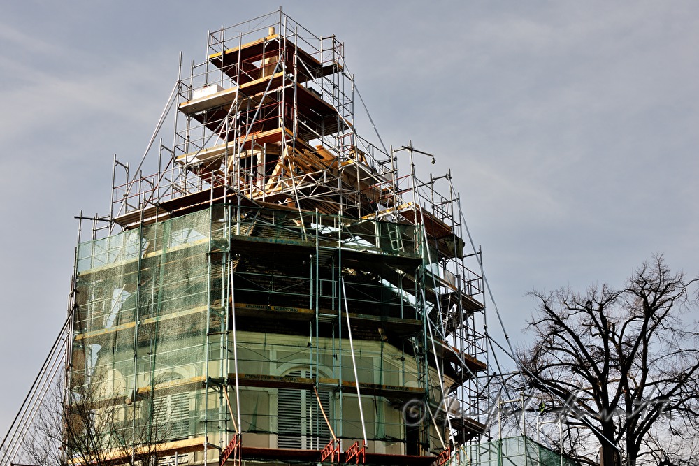 roof tiles are being lifted up to the roofers