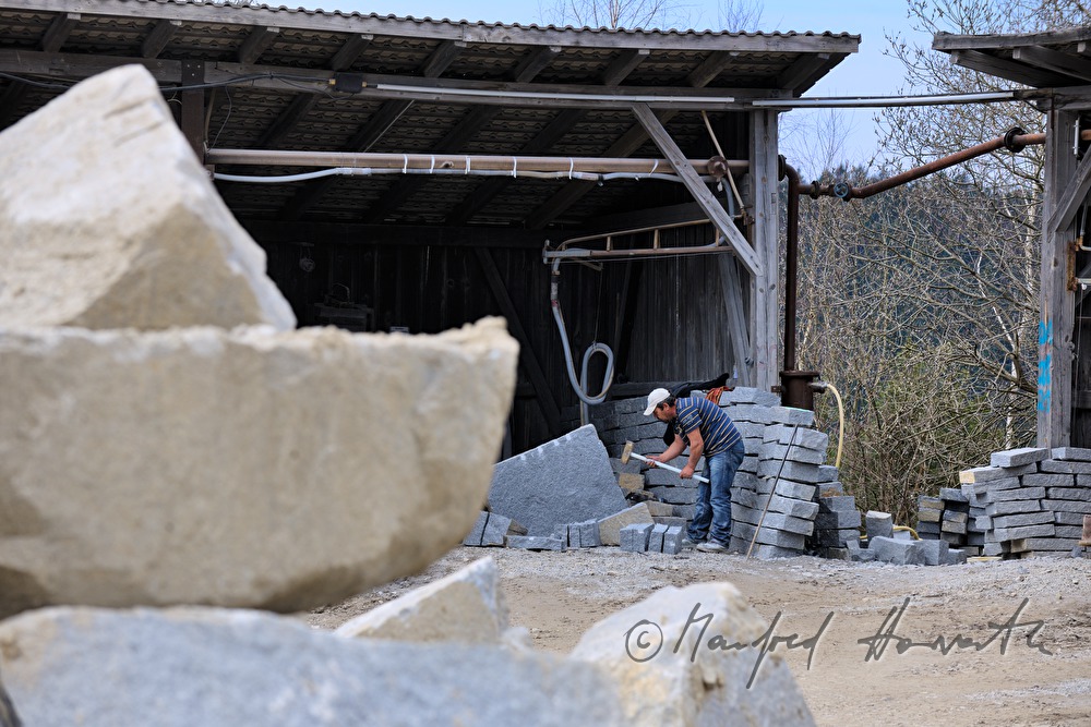 splitting of granite rocks for making cobblestones