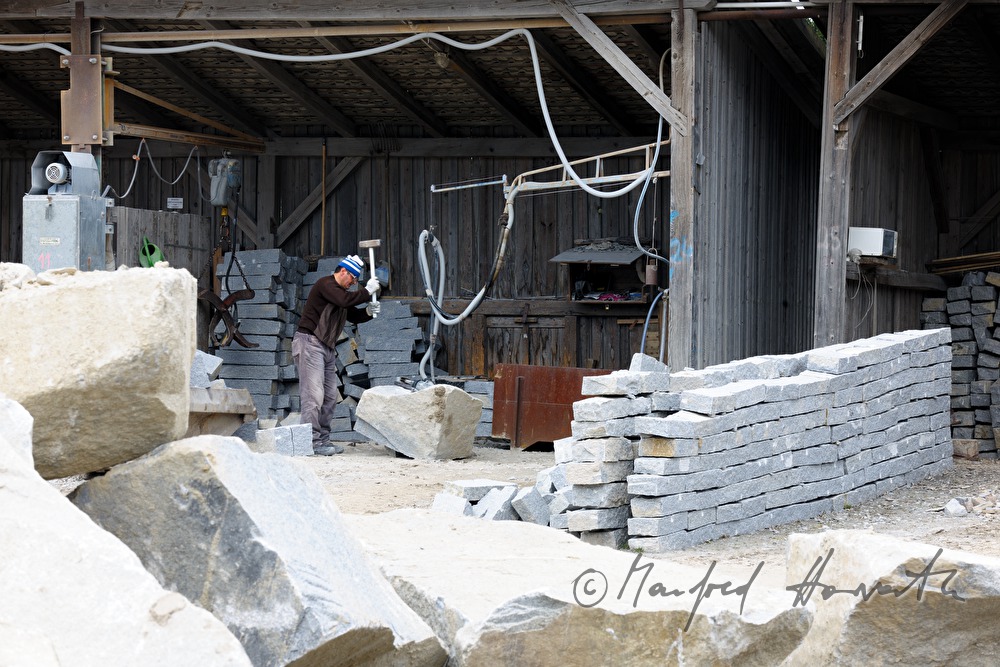 splitting of granite rocks for making cobblestones