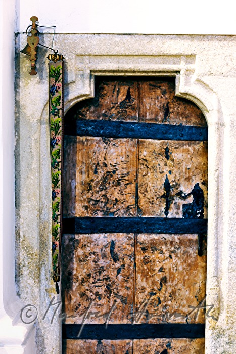 door with bell leading to the sacristy