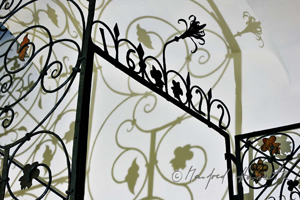 detail of a wroughtiron fence showing heads of turk men