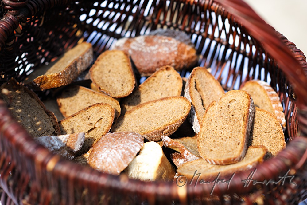 bread in a basket at the open air mass at the horse farm