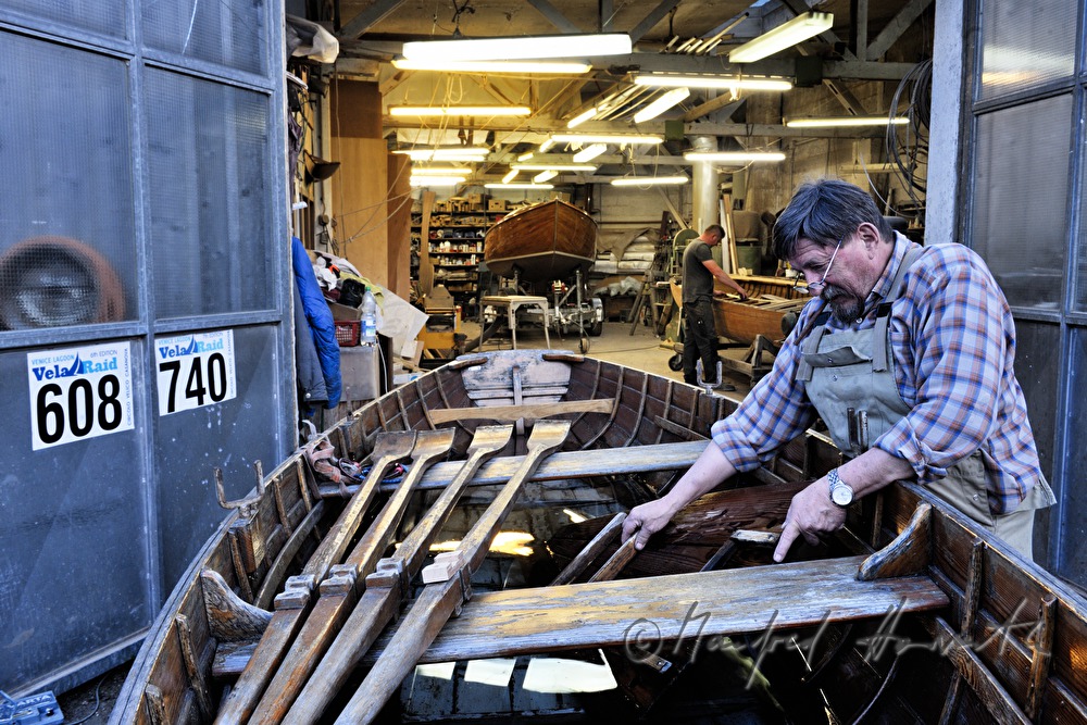boat builder working a rowing boat