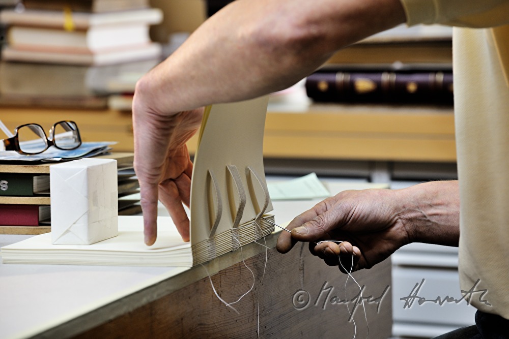 inching of the sewing of a handbound book