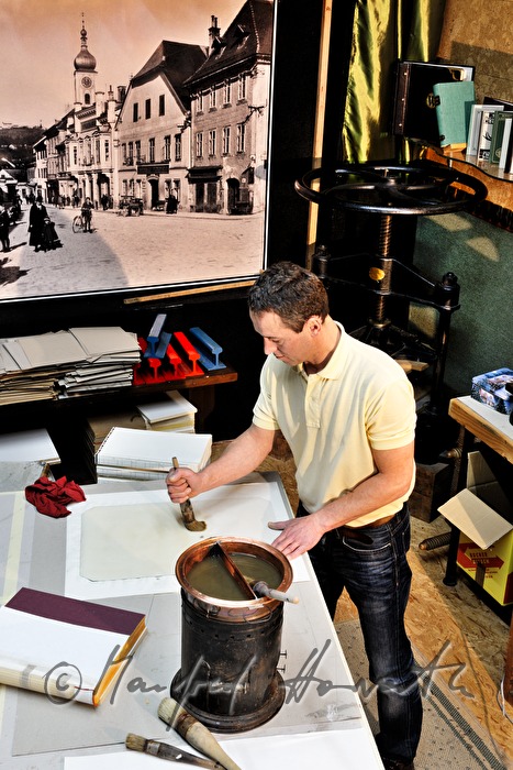 glueing of paper for a handbound book