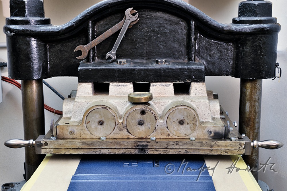 embossing machine in the workshop of bookbinder Gstettenhofer