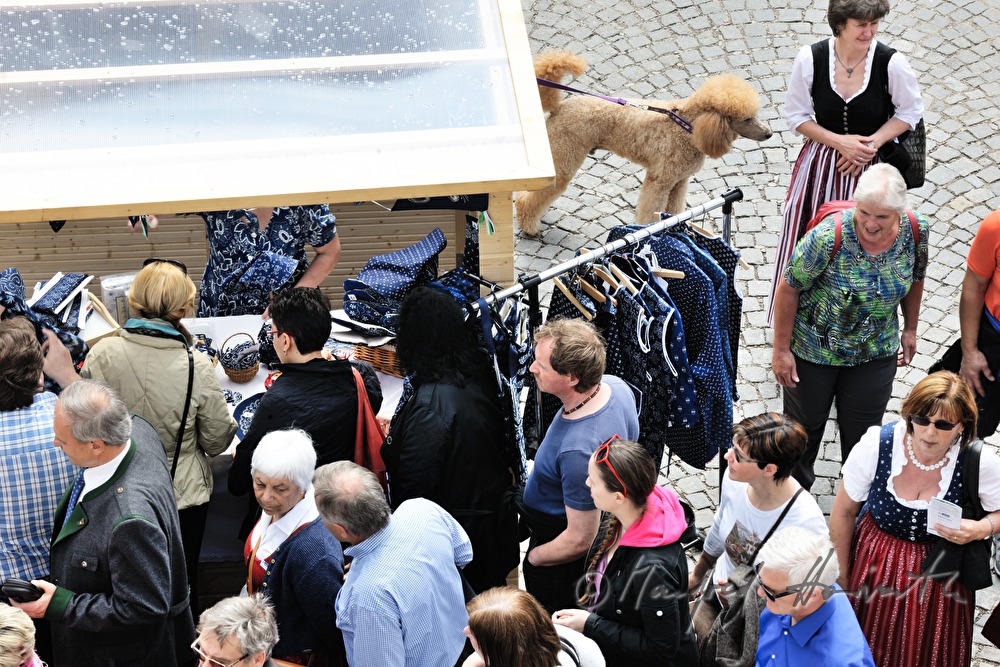 visitors of the Blueprint Market pass a kiosk