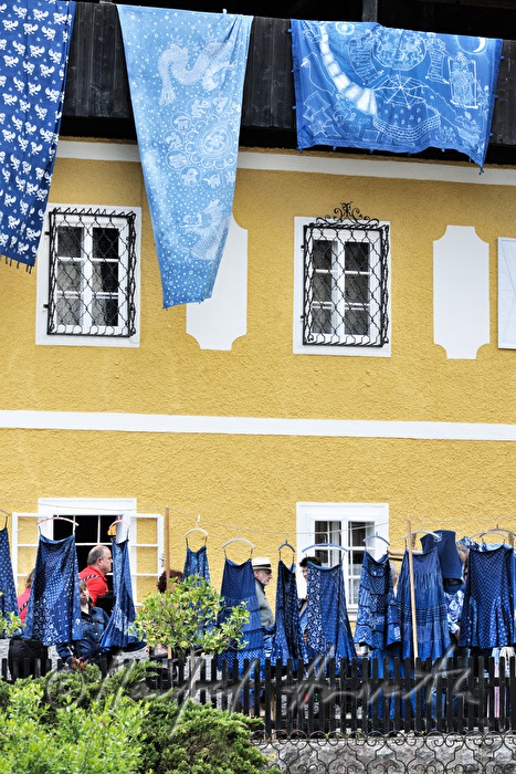 rags printed in blueprint hang op the balcony of the Indigo museum