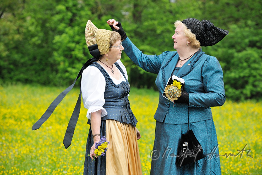meeting of women in traditional clothes