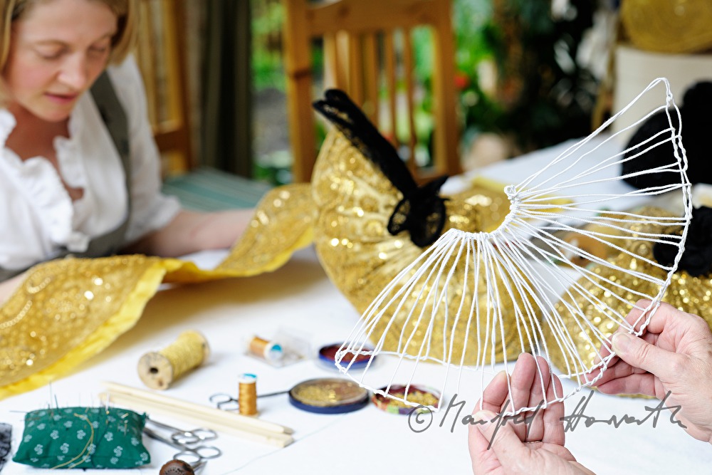 woman making her own Goldhaube