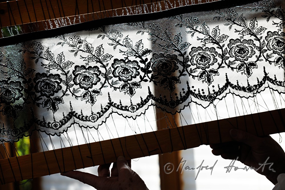 lace cloth in a frame for making a hat