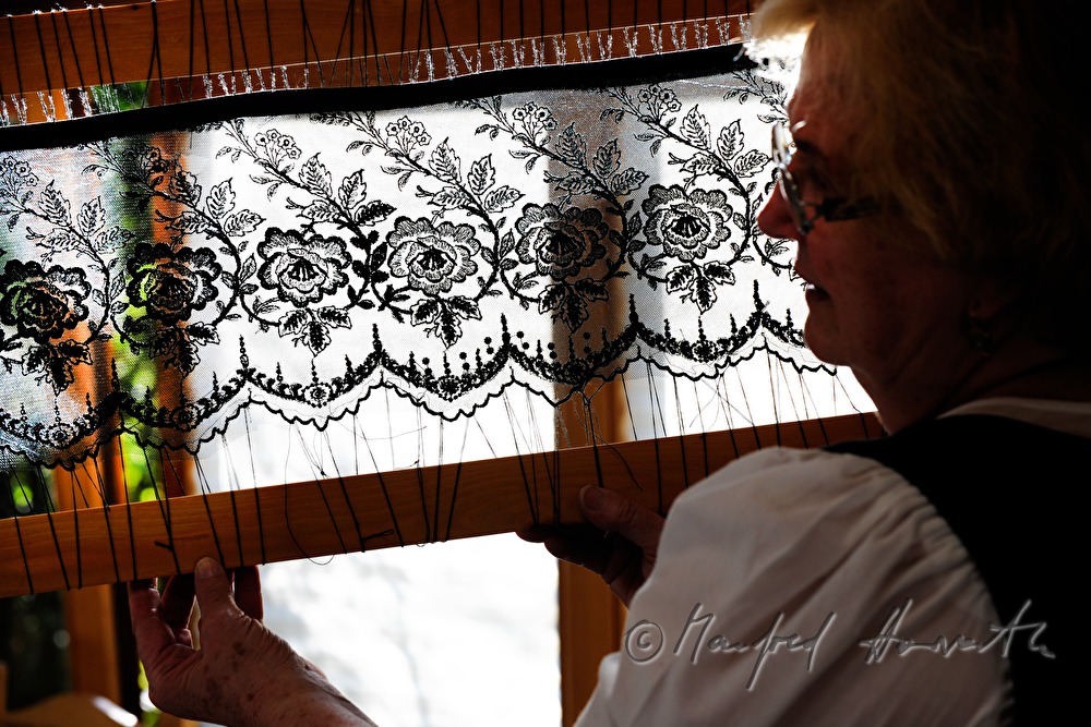 lace cloth in a frame for making a hat