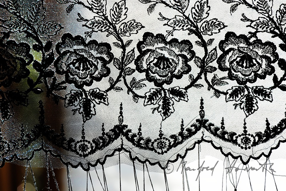 lace cloth in a frame for making a hat