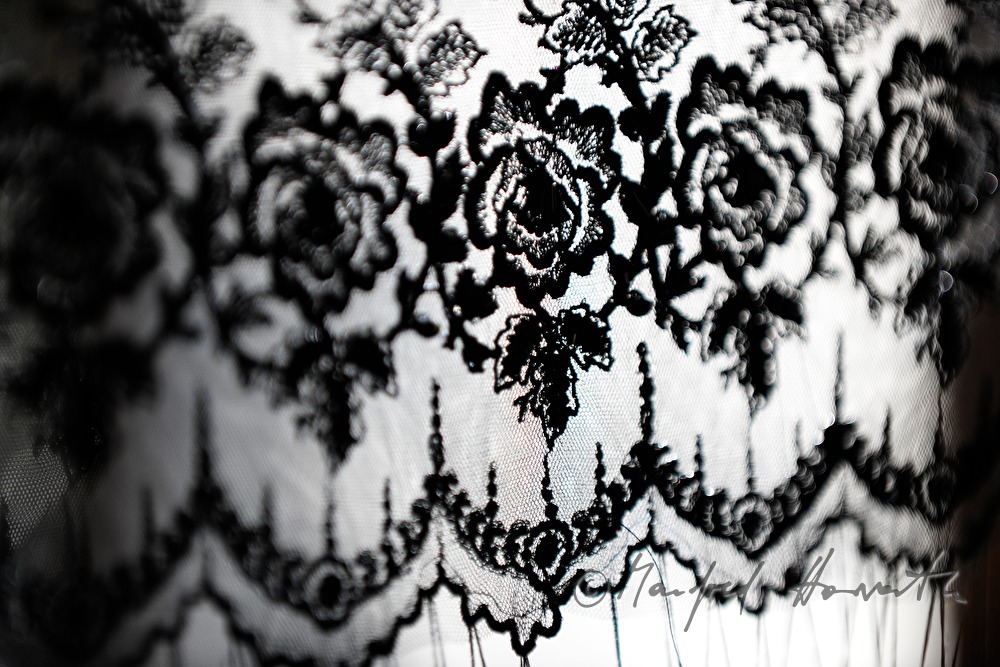 lace cloth in a frame for making a hat