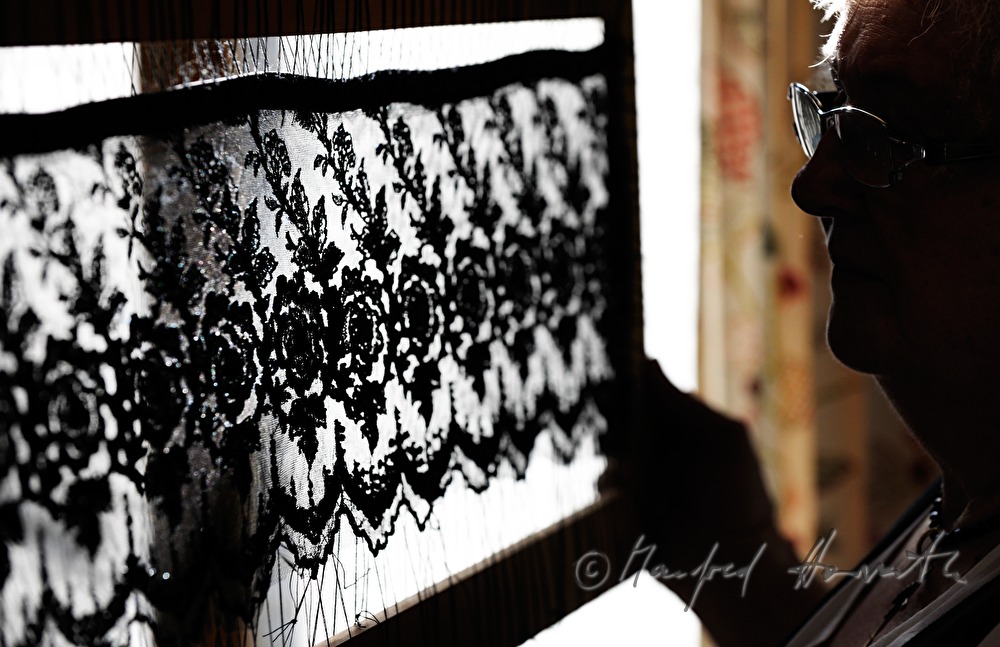 lace cloth in a frame for making a hat