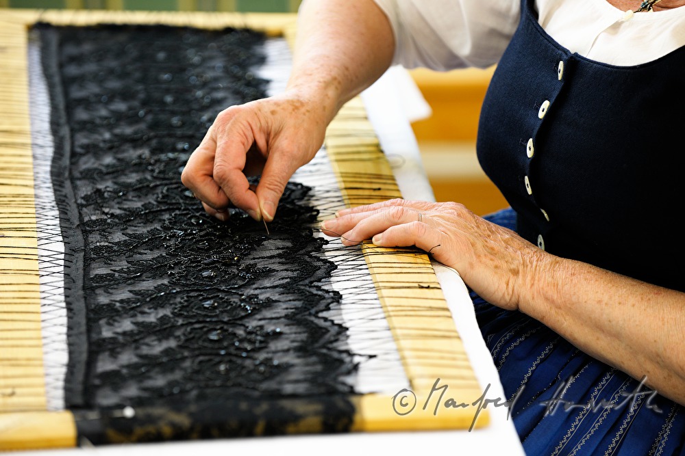 lace cloth in a frame for making a hat