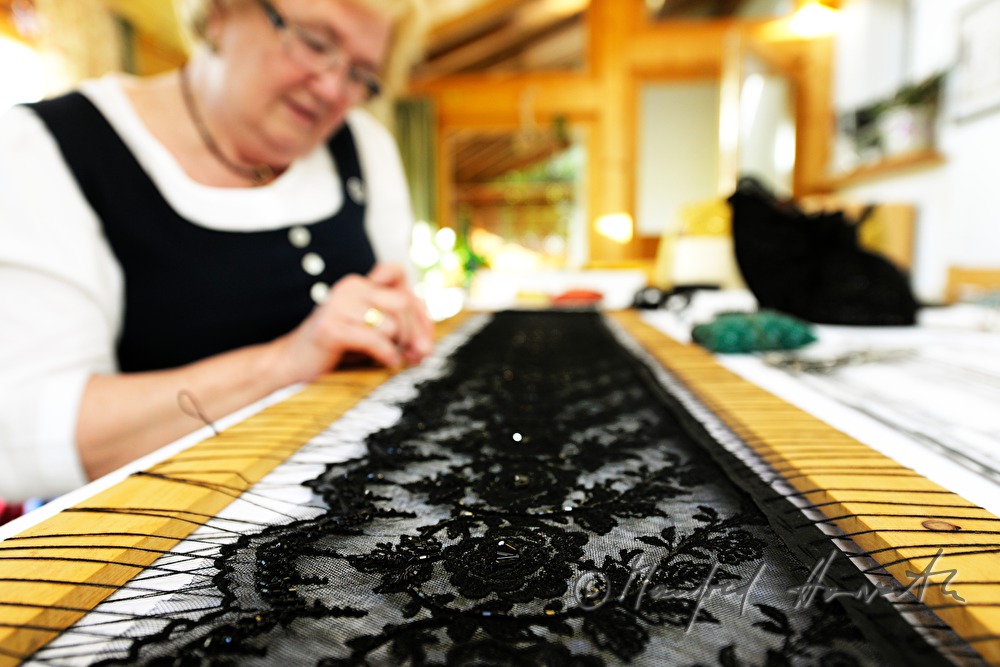lace cloth in a frame for making a hat