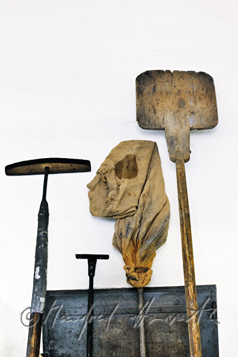 baker's tools stand near the wood fired oven