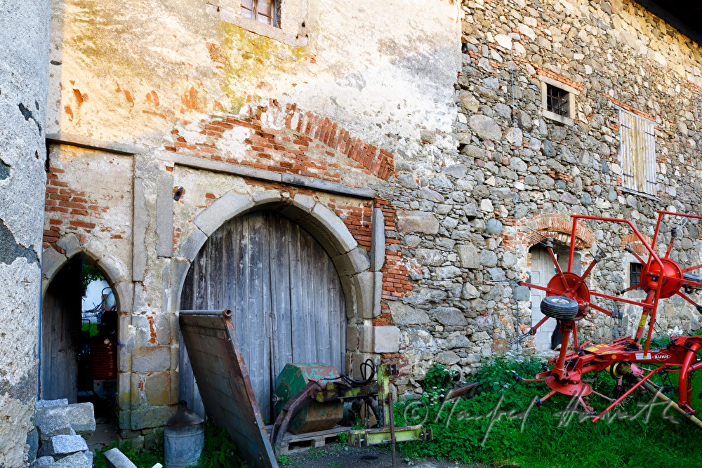 tractor in a garage with a door from the Gothic times