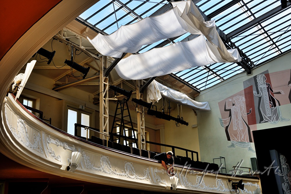 lighting technician sets the spotlights